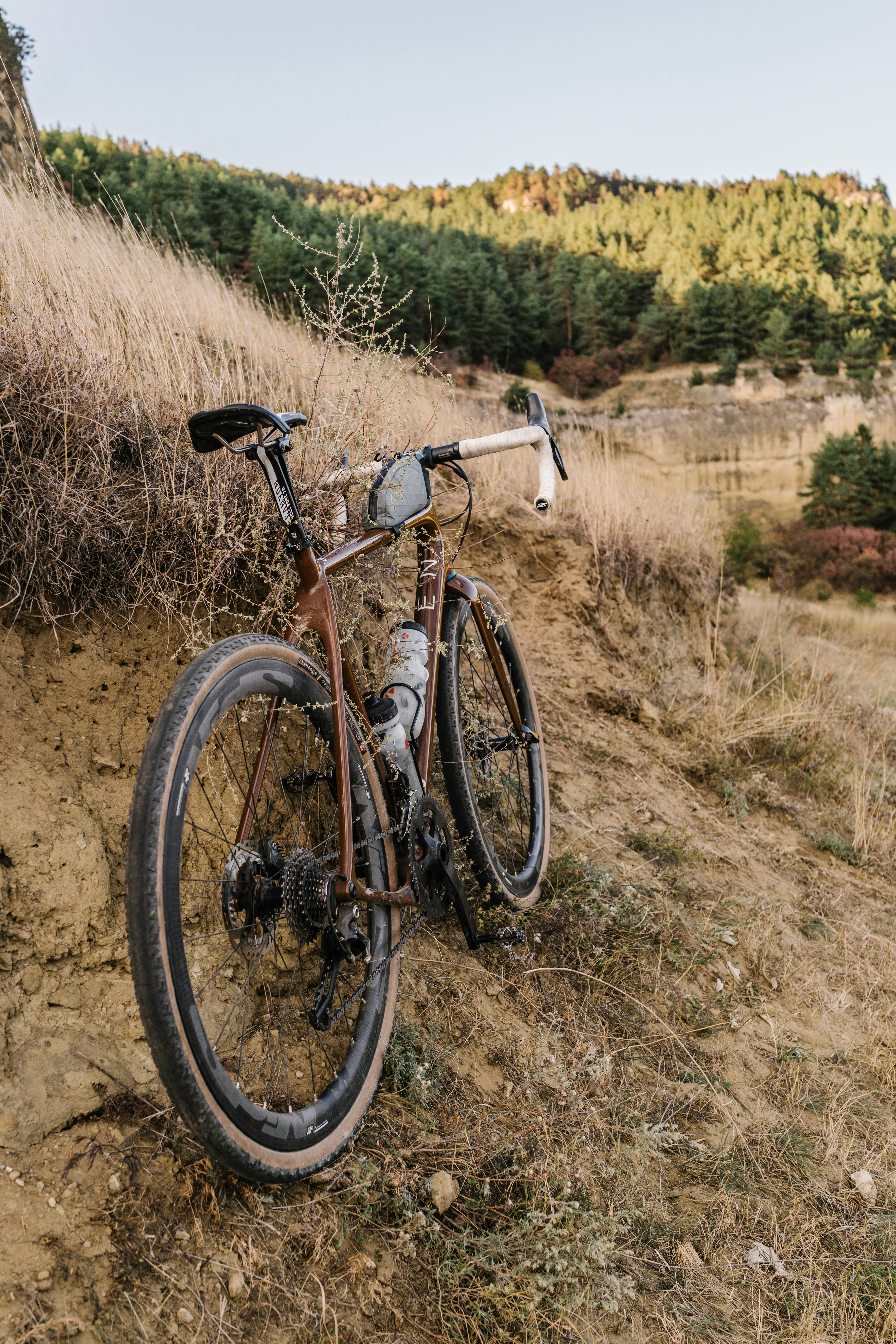 black and gray road bike on brown grass field during daytime